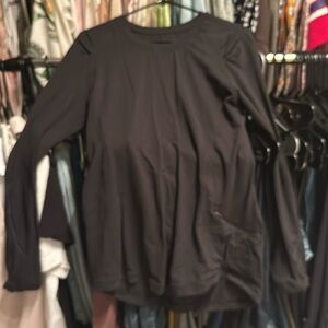Lululemon black layering top with zipper pockets and reflective sleeves